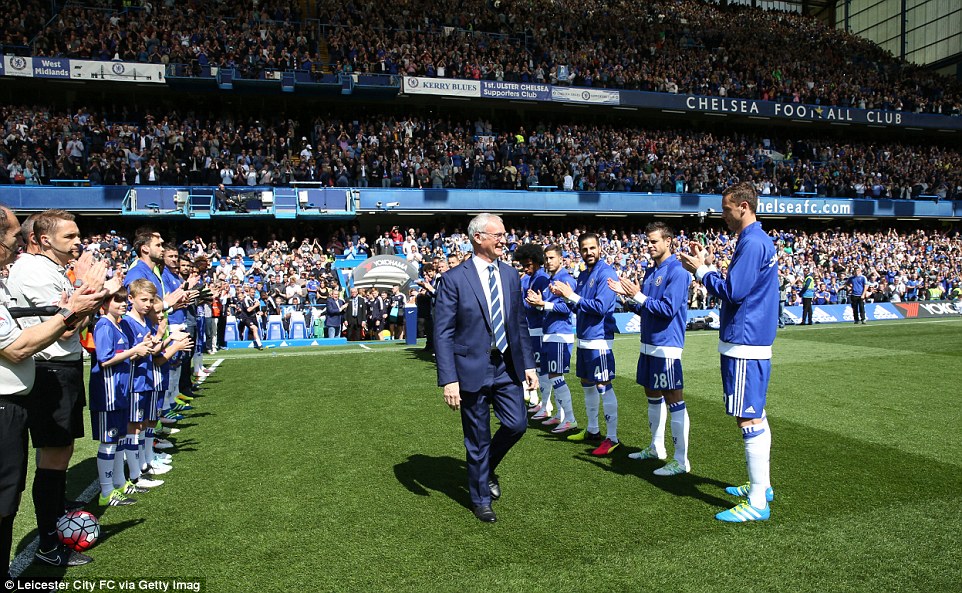 Manager Claudio Ranieri walks through the guard of honour as his Premier League title-winning outfit are applauded by the Blues