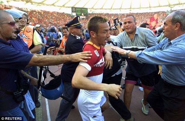 Hidetoshi Nakata is mobbed after Roma won the Scudetto after beating Parma 3-1